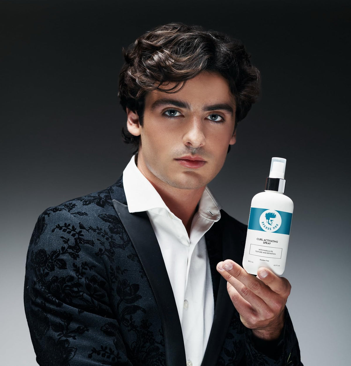 Avenue Man bottle in hand to show compact size for on-the-go styling