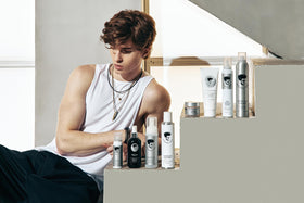 Avenue Man lifestyle grooming scene with man styling curls for polished everyday look