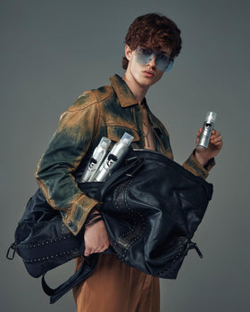 Avenue Man placed in a travel pouch with toiletries showing convenient carry-on readiness