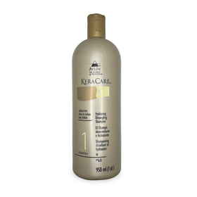 Avlon Keracare Humecto Crème conditioner in hand showing creamy slip for easy detangling