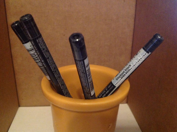 AVON Glimmersticks front packaging showing four black cream liners for bold defined eyes