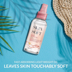 AVON SKIN SO SOFT close-up atomizer mist demonstrating easy application