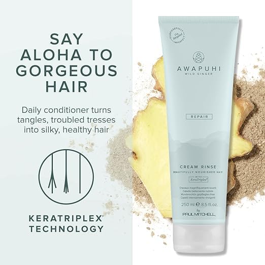 Awapuhi Wild Ginger bottle held in hand demonstrating Paul Mitchell size and travel convenience