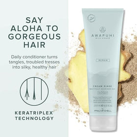 Awapuhi Wild Ginger bottle held in hand demonstrating Paul Mitchell size and travel convenience