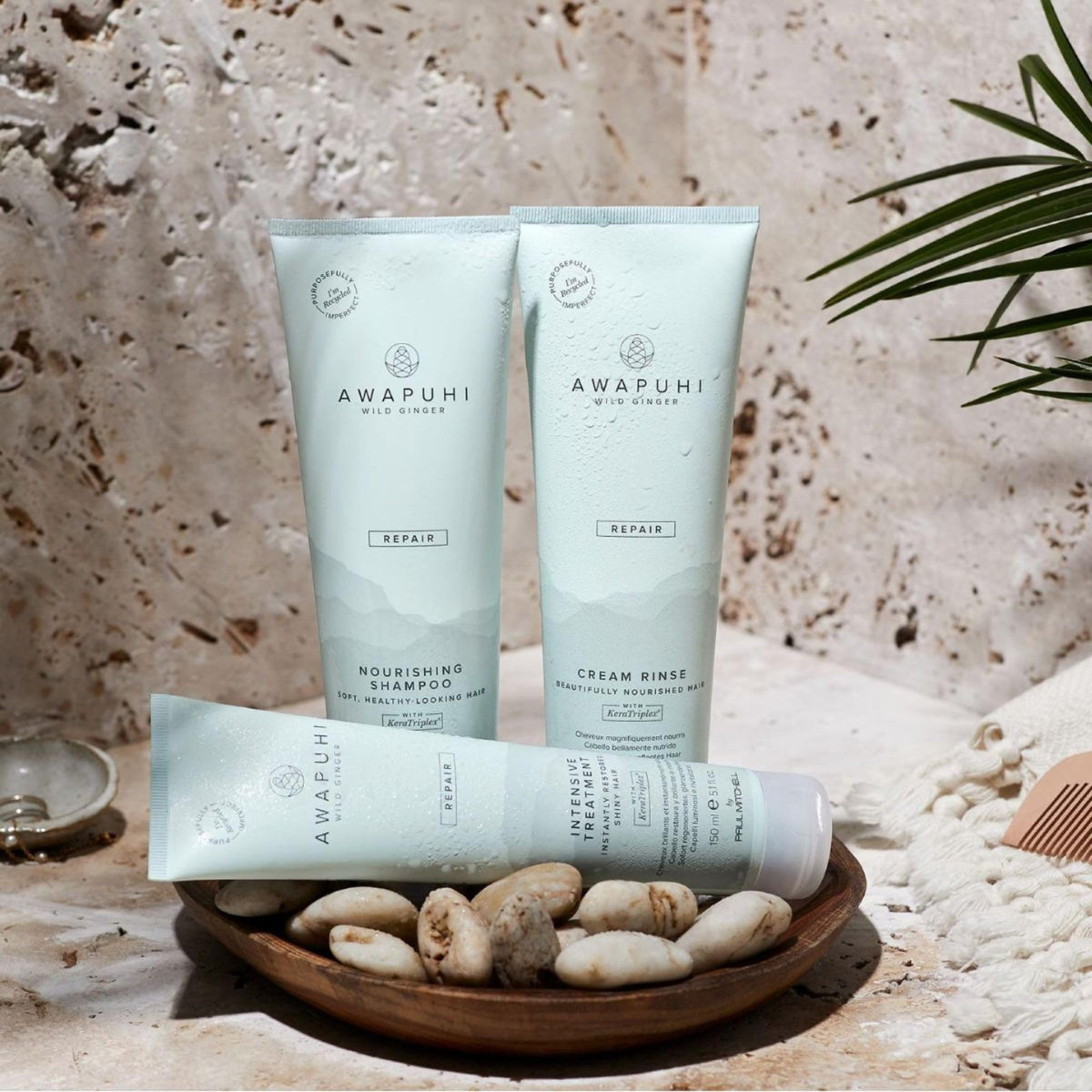 Awapuhi Wild Ginger on bathroom shelf with towel, evokes salon-level results at home