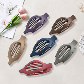 AWAYTR clips inside a purse showing travel-ready convenience and spare set