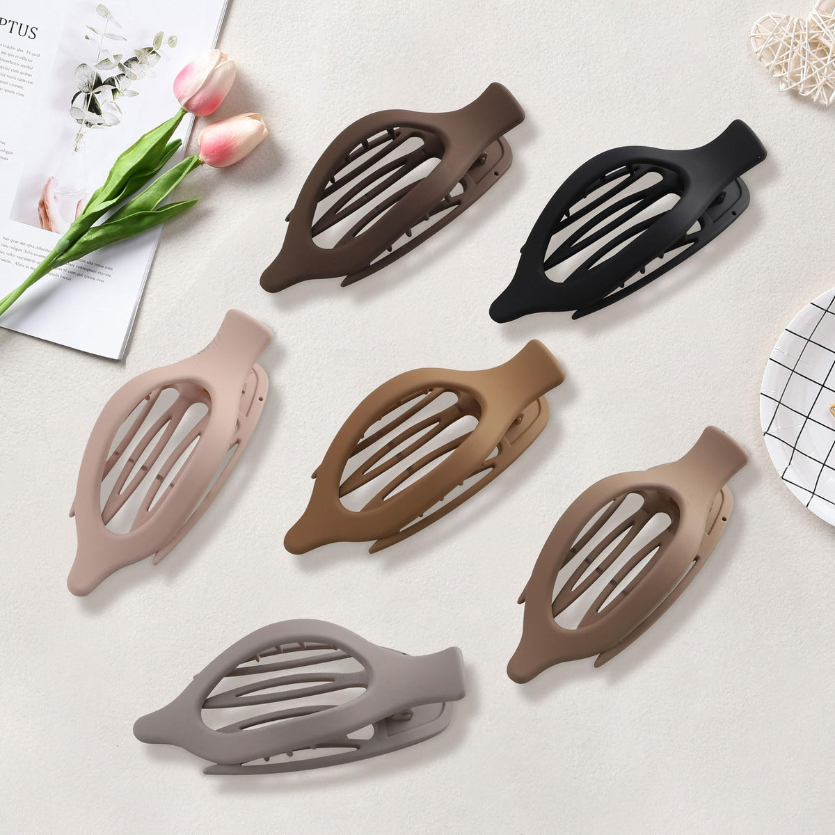 AWAYTR clips packed inside a purse demonstrating compact portability and convenience