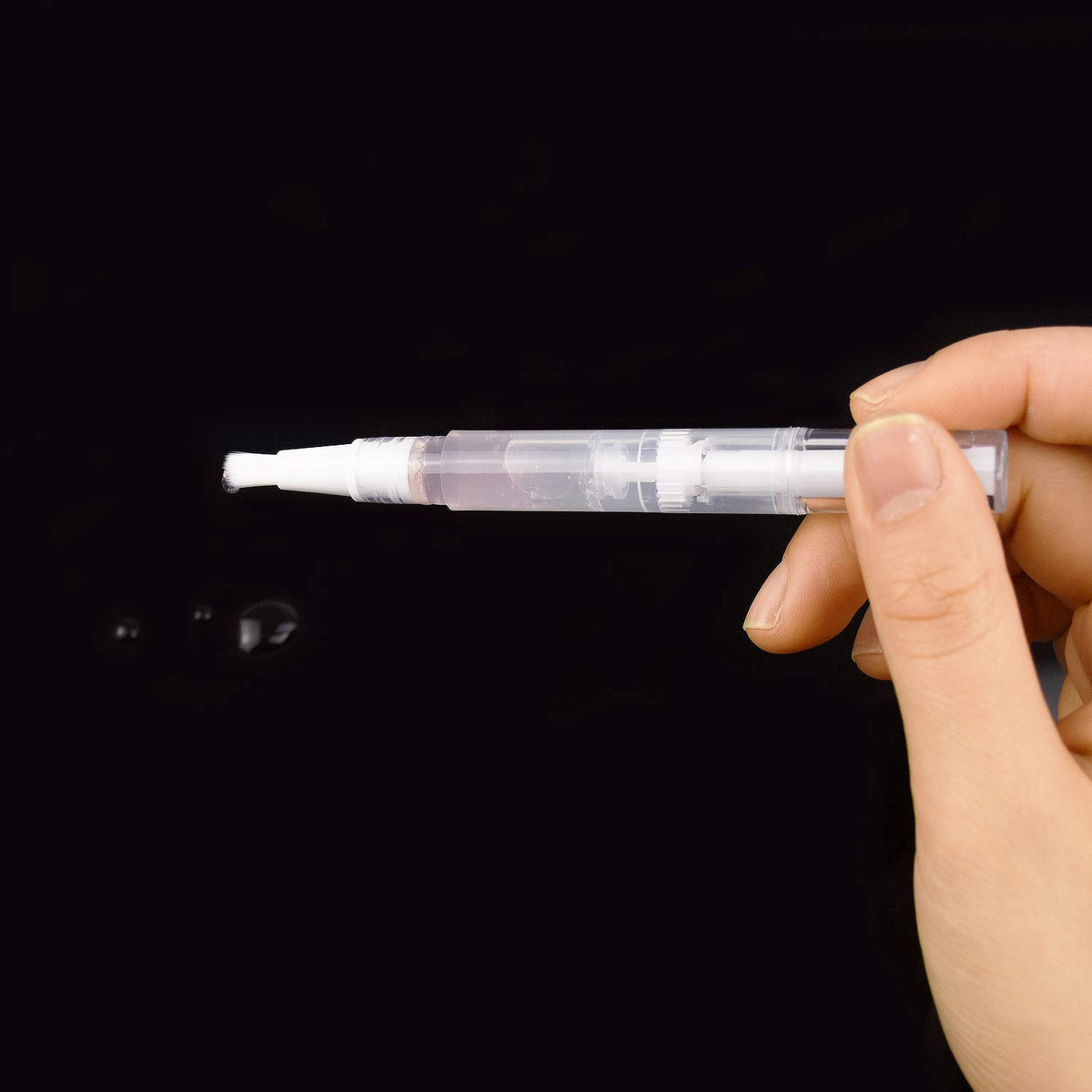 Awpeye hands filling pen with syringe demonstrating quick refill convenience