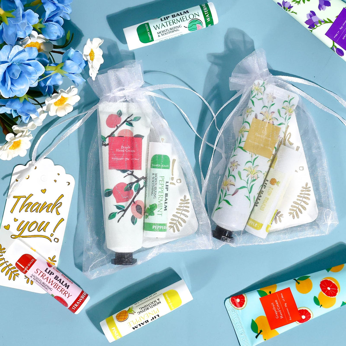 AZEN white organza bag display with creams and balms inside for elegant gifting