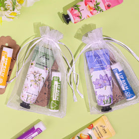 AZEN hand cream and lip balm inside organza bag as guest favor benefit