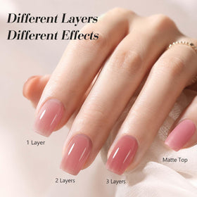 AZUREBEAUTY manicure on hand with milky pink sheer layers, natural look