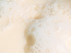 Babo Botanicals close-up of solid bar texture highlighting smooth, moisturizing surface