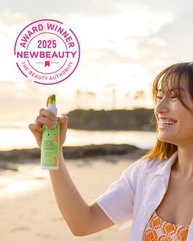 Babo Botanicals bottle in hand demonstrating travel-friendly size