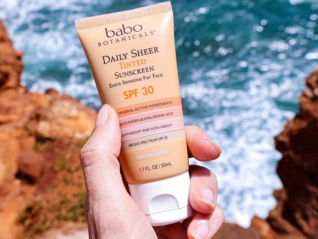 Babo Botanicals tube in beach bag illustrating travel-friendly protection