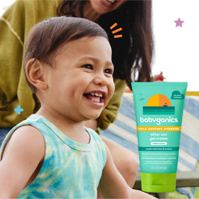 BabyGanics tube in a beach bag indicating family-friendly post-sun care