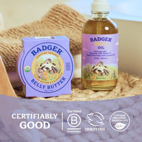 Pregnant person using Badger belly butter in a cozy maternity scene for gentle relief