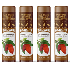 Badger front packaging of creamy cocoa butter lip balm showing large four-pack benefits