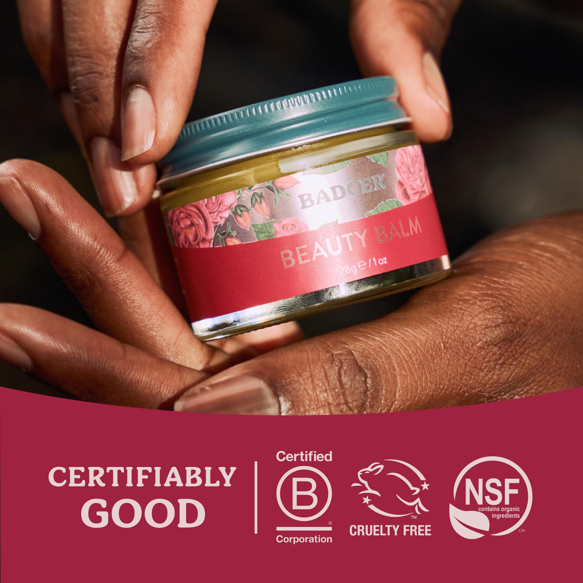 Badger rose beauty balm glass jar on recycled surface emphasizes sustainable packaging