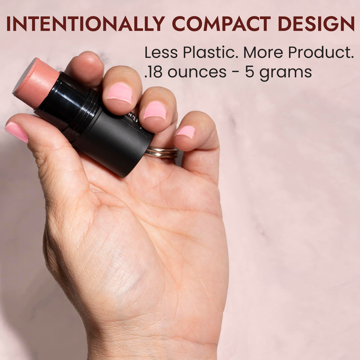 BaeBlu size comparison hand holding stick highlighting travel-ready convenience