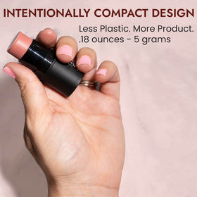 BaeBlu size comparison hand holding stick highlighting travel-ready convenience