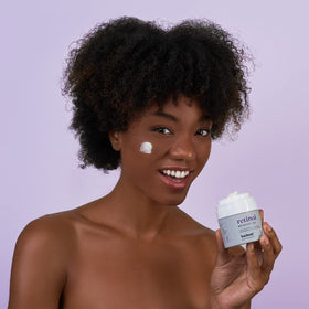 Baebody in lifestyle shot with smiling woman demonstrating daily use