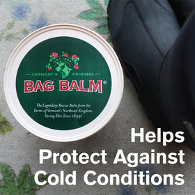 Hands being rubbed with Bag Balm showing fast moisturizing benefit