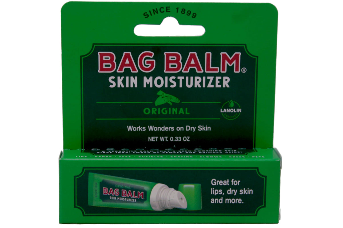 Applying Bag Balm to a dry hand illustrating brand protection and softening effect