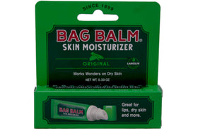 Applying Bag Balm to a dry hand illustrating brand protection and softening effect