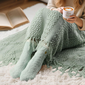 BaiCai fuzzy socks texture demonstrating plush comfort and foot warmth
