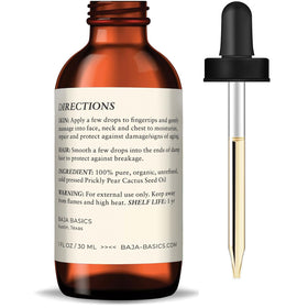 Baja Basics one ounce bottle next to coin for scale showing travel-friendly size benefit
