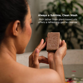 Bali Soap bar in hand for scale showing travel-friendly size and usability benefit