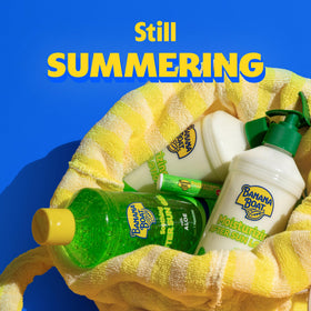 Banana Boat tube held in hand for size comparison and easy reapplication on-the-go