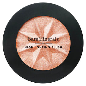 bareMinerals swatch on arm showing Peach Glow warmth and buildable coverage benefit