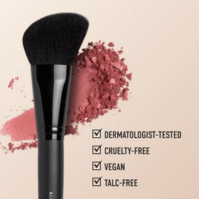 bareMinerals brush applying blush to cheek, showing effortless blend and healthy color