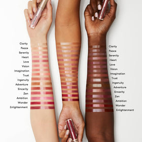 bareMinerals applicator and glossy texture on fingertip, showing smooth non-sticky finish