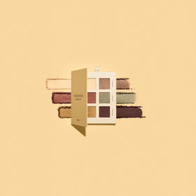 bareMinerals palette next to a coin showing compact travel-friendly size and convenience