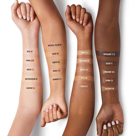 bareMinerals travel-size tube held in hand for scale and easy-carry benefit