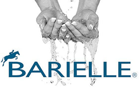 BARIELLE next to coin for scale showing compact one-ounce travel benefit