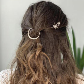 BARTOSI flatlay with clips and jewelry suggests gift-ready styling