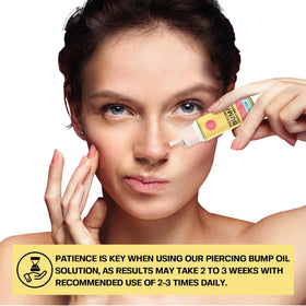 BASE LABORATORIES oil massaged onto ear cartilage to hydrate and soften raised bumps