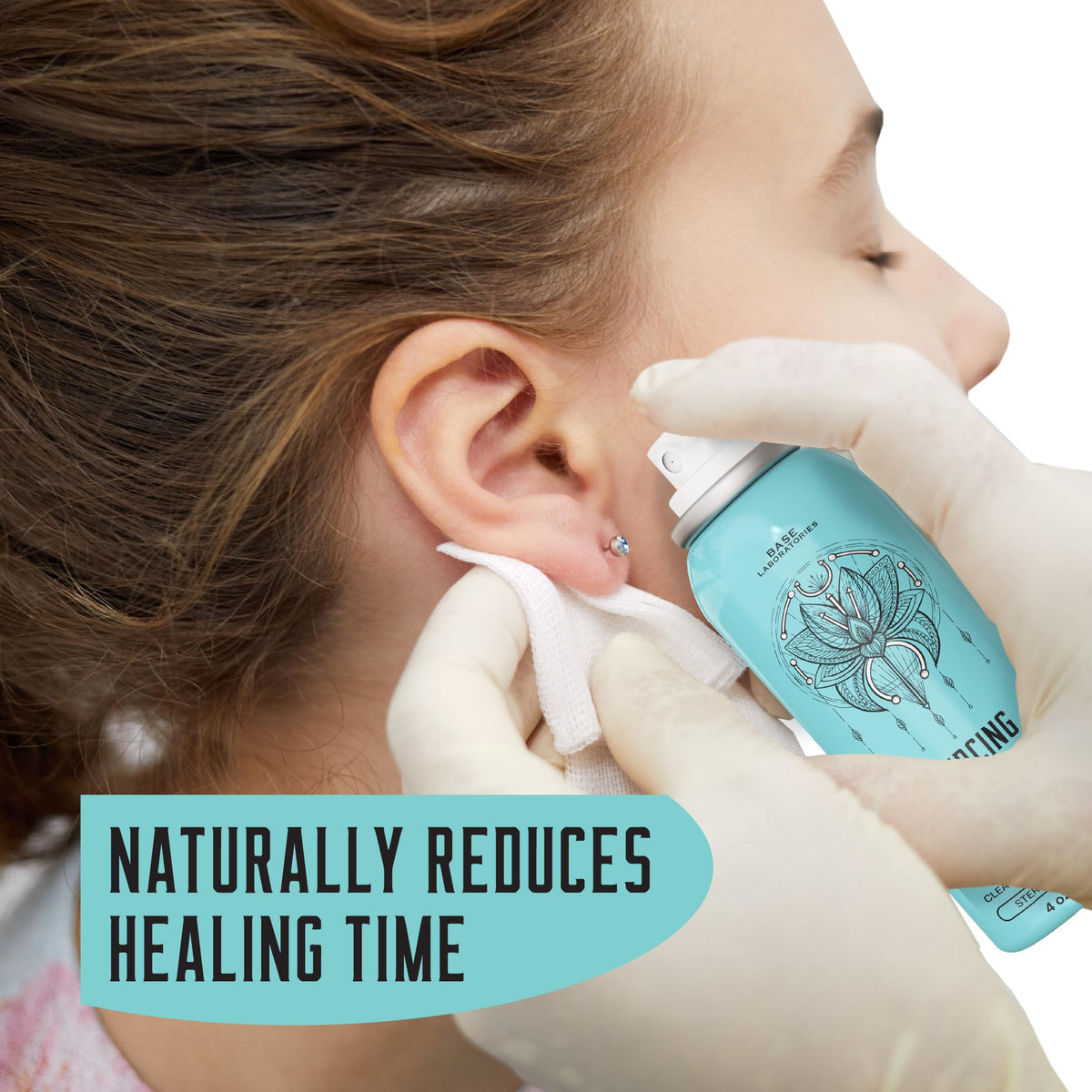 BASE LABORATORIES saline spray being used on a nose piercing to reduce debris