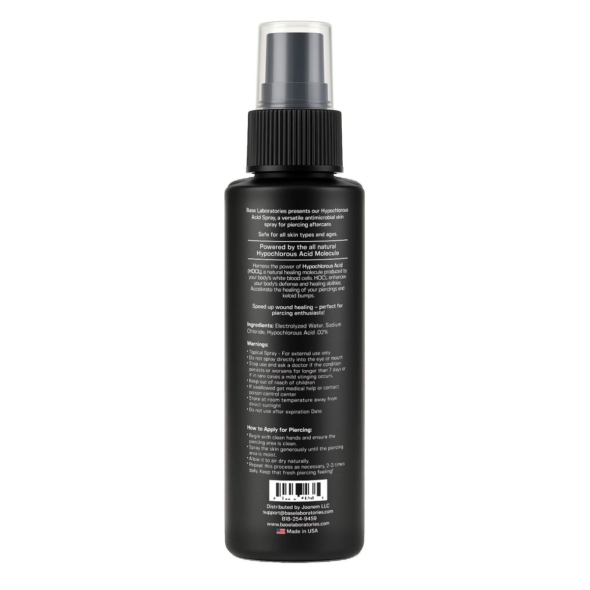 BASE LABORATORIES travel-friendly bottle next to keys to show portability and convenience