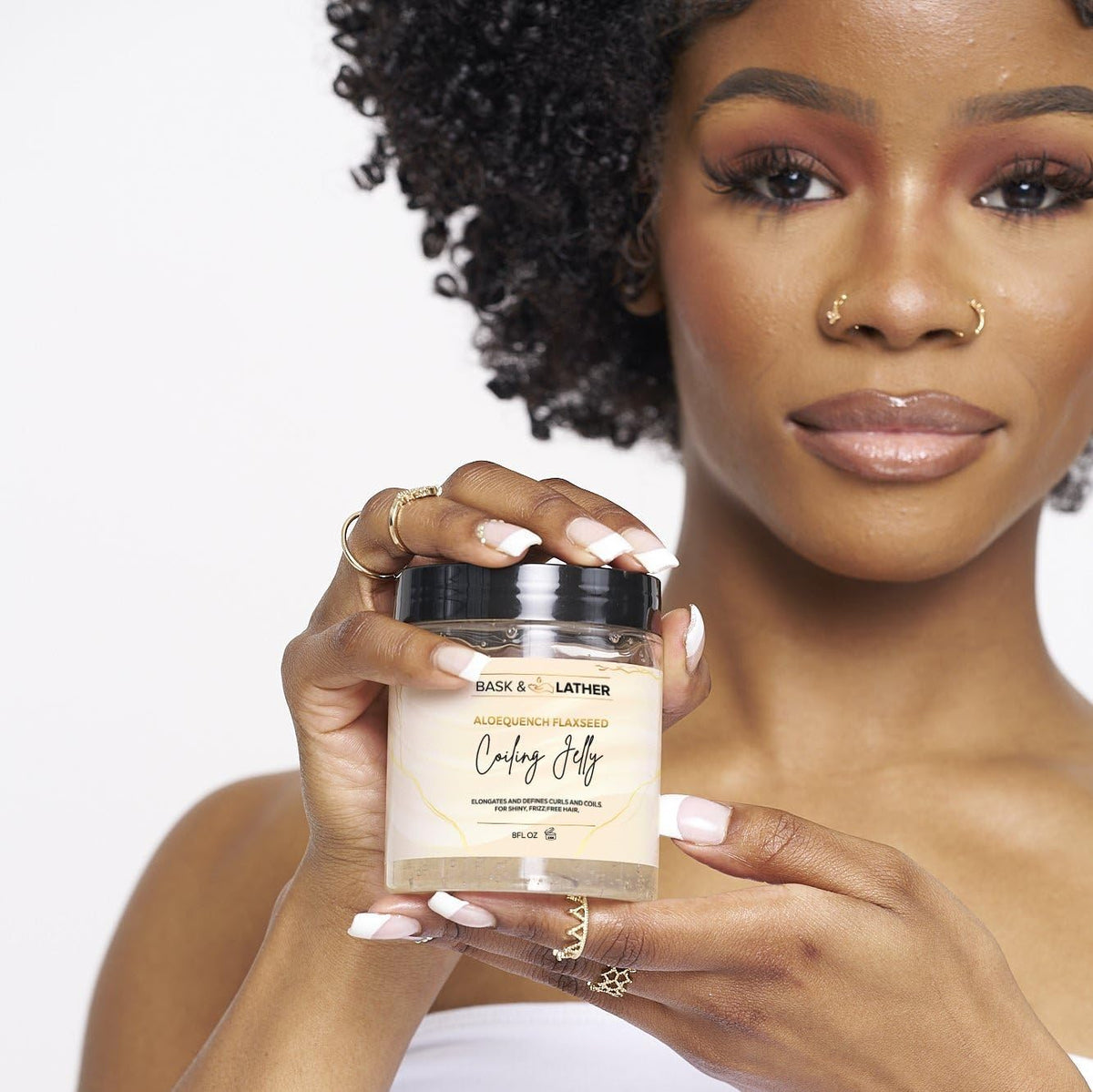 BASK & LATHER application in curly hair demonstrating defined frizz-free coils