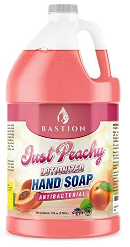 Bastion jug near a soap pump demonstrating refill compatibility and easy transfer benefit