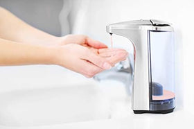 Creamy peach-scented lather in hand with Bastion bottle, shows moisturizing and rich foam