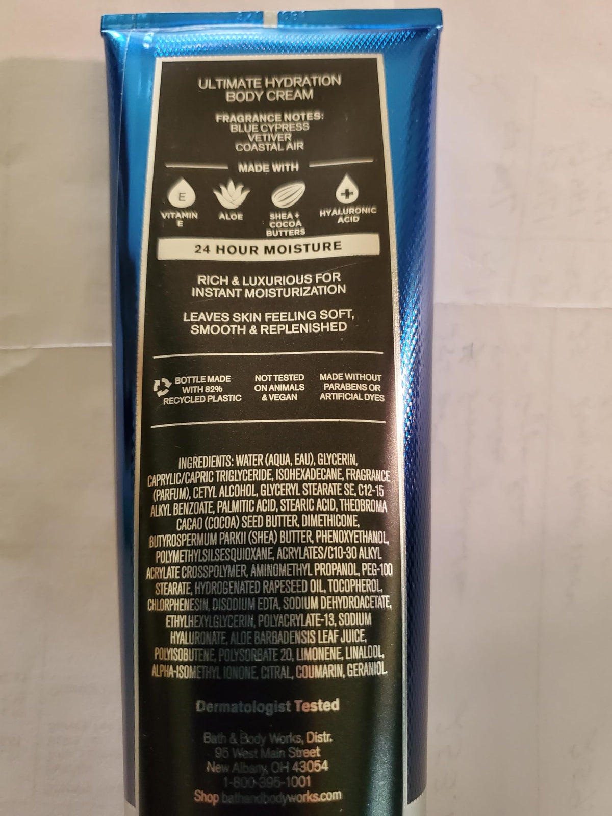 Bath & Body Works tube with cap open and cream dispensing for quick-absorb hydration benefit