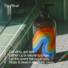 Bathing Culture bottle in hand showing 16 fl oz scale and convenient size