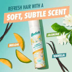 Batiste aerosol mid-spray demonstrating quick coverage and oil absorption