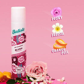 Batiste blush being applied to roots to add volume and absorb grease on the go