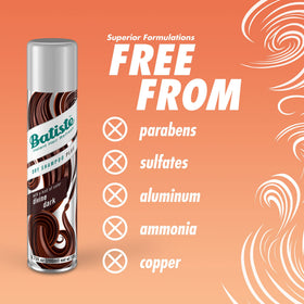 Batiste dark-hair size comparison in hand showing travel-friendly cans